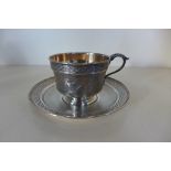 A continental silver cup and saucer, saucer 15cm diameter, engraving to cup, approx 6.2 troy oz,