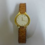 A ladies Beluga Ebel 18ct yellow gold quartz wristwatch, 23mm wide, with an Ebel light tan crocodile