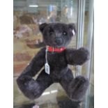 A Steiff Black Bear made in 2004 - limited to 3000 EAN 038150 - 32cm tall with box and certificate