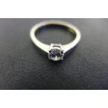 An 18ct white gold diamond solitaire ring, the stone measuring approx 0.4cts, ring size Q, approx