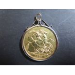 A Victorian double sovereign dated 1887 - in a plain pendant 9ct mount, not soldered, mount
