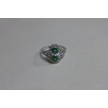 An Art Deco style emerald and diamond ring, set in 18ct white gold - Size N/O, approx 3.8 grams,