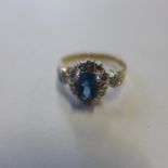 A 9ct hallmarked blue topaz and diamond set ring, size M/N approx 3.4 grams, generally good