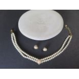 Christian Dior Perles - pearls - A boxed double string of Dior imitation pearls with gold plated and