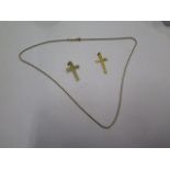 Two 9ct gold crucifix's and a 9ct chain, total weight approx 4 grams