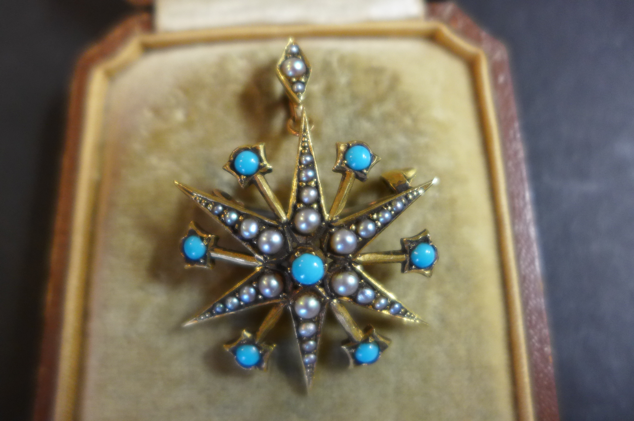 A Vicrtorian/Edwardian 15ct gold seed pearl and turquoise star brooch/pendant,width 30mm - fitted