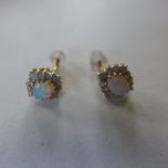 A pair of 18ct gold, opal and diamond earrings, approx 1.9 grams - in generally good condition