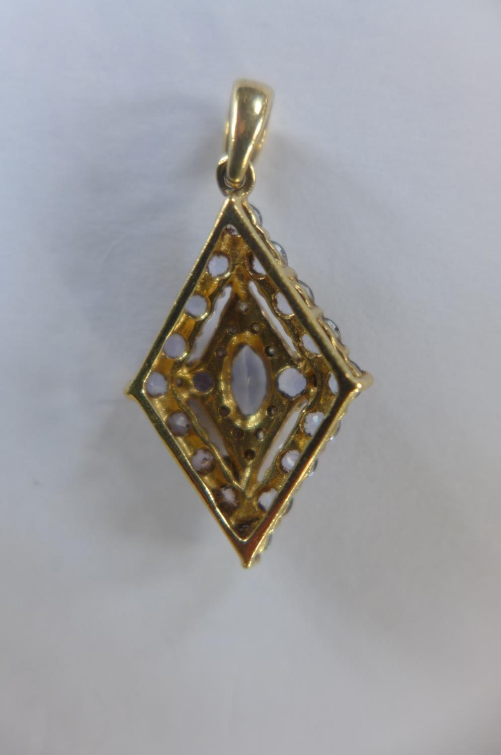 A 9ct gold amethyst pendant and silver gilt ring, size P, approx 1.4 grams - Image 2 of 2