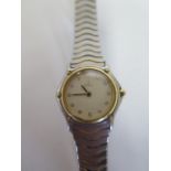 A ladies Ebel steel and gold plated 'wave' wristwatch with white stone set face Quartz movement, not