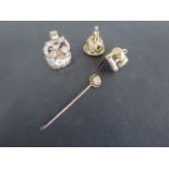 A collection of three 9ct gold seal fobs and a 15ct gold and diamond stick pin including an