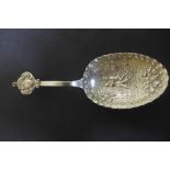 A large caddy spoon with continental hallmarks and later English hallmarks, London 1896 sponsor