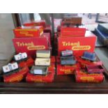 A collection of nine Triang goods wagons - a brake car and platforms, all boxed, wagons all in