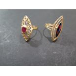 Two 18ct gold rings, marquise shape, one set ith an oval ruby, size N - the second with red and blue