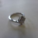 A 9ct white gold and diamond, four set in a square, ring, size L, approx 3.3 grams - in generally