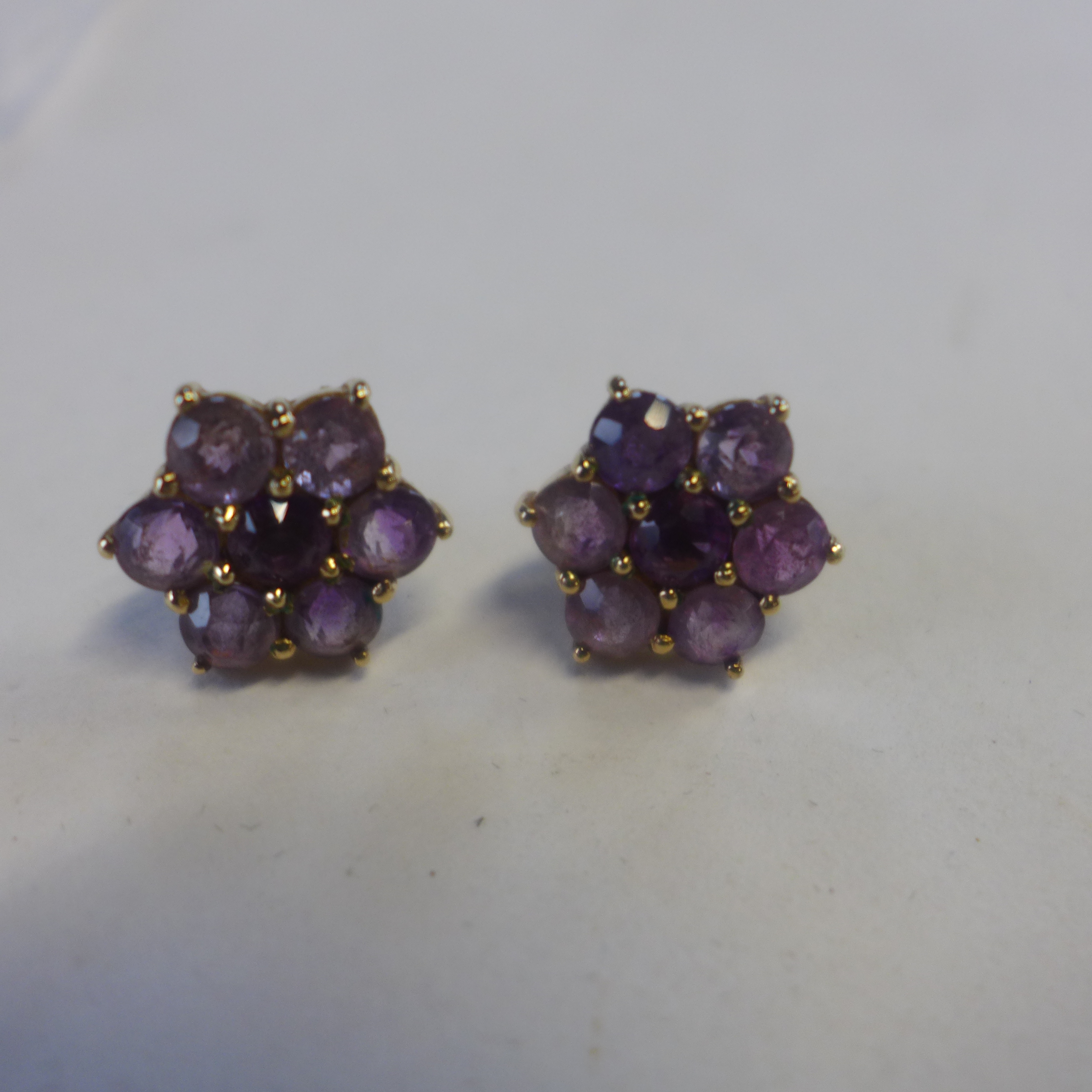 A pair of 9ct amethyst cluster earrings, approx 4 grams, generally good