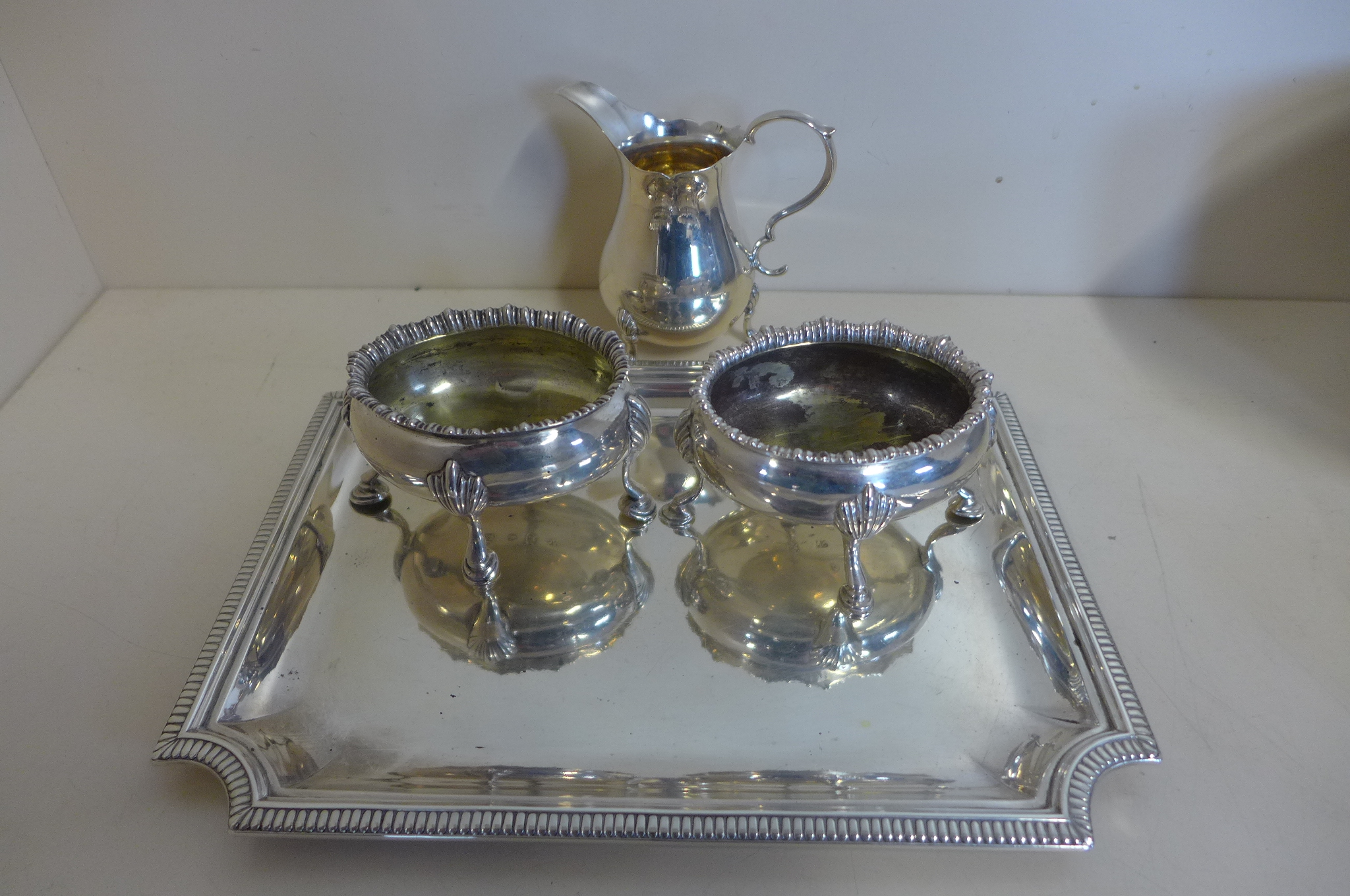 A pair of Georgian silver salts together with a later cream jug and a silver tray, weight approx