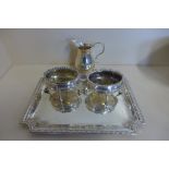 A pair of Georgian silver salts together with a later cream jug and a silver tray, weight approx