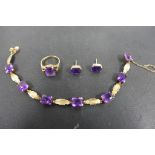 A suite of 9ct gold and amethyst jewellery, comprising of a bracelet, studs earrings and ring, the