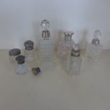 Eight silver topped scent bottles, various styles