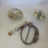 A collection of four Scottish silver brooches