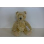 A Steiff bear circa 1950/60's, 28cm tall, button in ear, Golden mohair and felt pads, in good