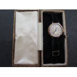 A ladies 9ct light rose gold Art Deco style wristwatch, white enamel face with Arabic numerals, dial