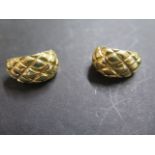 A pair of 18ct yellow gold earrings by Chimento, post fitting with safety clip to a curved, cross