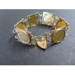 A 9ct gold half sovereign bracelet containing six half sovereigns dated between 1903 and 1910 -