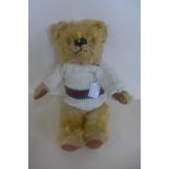 A Merrythought bear circa 1950/60's, 33cm tall, extensive mohair loss to chest and general loss