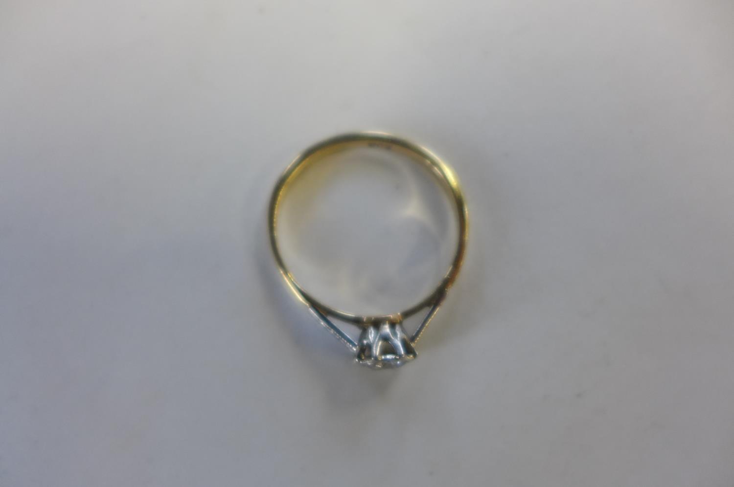 A 9ct gold diamond solitaire ring, the stone set in a white gold setting with yellow gold shank, the - Image 3 of 3