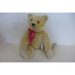 A Steiff bear, late 1930's - 30cm tall, golden mohair with felt pads, button in ear, non working