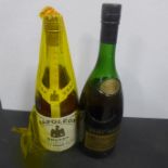 A 24 fl oz bottle of Remy Martin Cognac and a bottle of Bertineau and Co Napoleon Brandy Remy