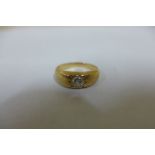 A diamond solitaire ring in a yellow gold setting, tests to 18ct, ring size N, approx 5 grams