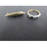 A 9ct gold sapphire and white stone half eternity ring, size K, approx weight 1.7 grams, fully