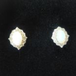 A pair of 18ct gold, opal and diamond earrings, approx 2.8 grams - in generally good condition