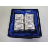 A set of six silver napkin rings, approx 3.8 troy oz, with box, in good condition