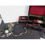 A vintage costume jewellery in a jewellery box, including 9ct gold and jadette heart pendant etc