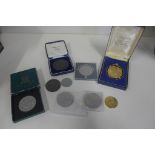 A Victorian Crown, a 1951 Crown and other coins and tokens, nine in total