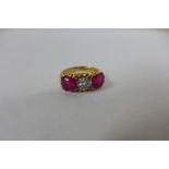 A good ruby and diamond hallmarked 18ct yellow gold ring, central diamond approx 0.50ct, rubies