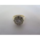 An impressive 18ct gold diamond cluster ring, the central stone measuring approx 0.42cts, surrounded