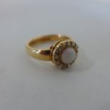 A hallmarked 18ct yellow gold opal and diamond ring, size S, approx 7.9 grams, in good condition