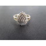 A 9ct gold diamond cluster ring in four tiers of small diamonds in a tear drop shape size approx