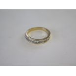 An 18ct hallmarked gold diamond ring set with six diamonds, size O/P, approx 3.5 grams, diamonds