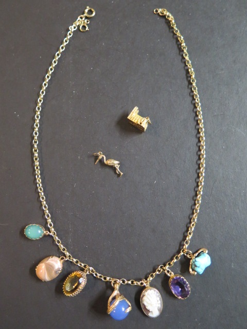 A 9ct gold belcher link neck chain mounted with seven 9ct gold charms, six containing semie-precious - Image 2 of 4