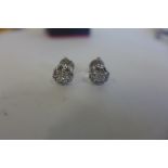 A pair of 18ct white gold diamond cluster earrings, 6mm diameter, approx 2.4 grams, in good