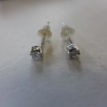 A pair of 18ct white gold and diamond earrings, approx 0.4 grams - in generally good condition