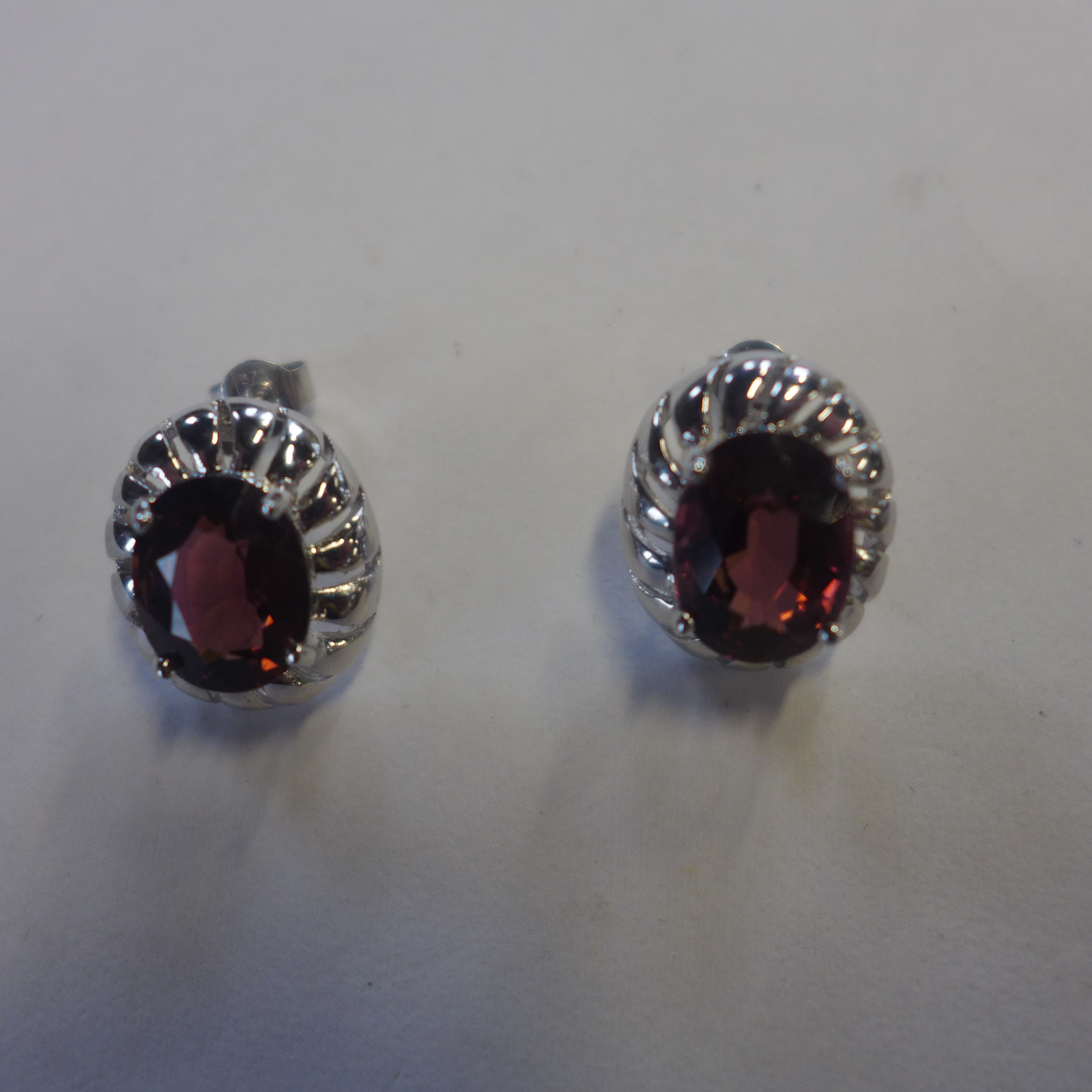 A pair of 9ct white gold pink stone set earrings, approx 4.8 grams, generally good