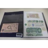 A folder of thirty English bank notes, most uncirculated and six Australian notes, seven Scottish