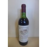 A bottle of 1983 Roc de Puisseguin Le Vieux Pigeonnier-Puisseguin red wine - level to base of neck