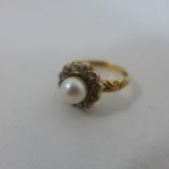 An 18ct yellow gold pearl and diamond ring, marked 18ct, size L.M, approx 4.1 grams, some usage